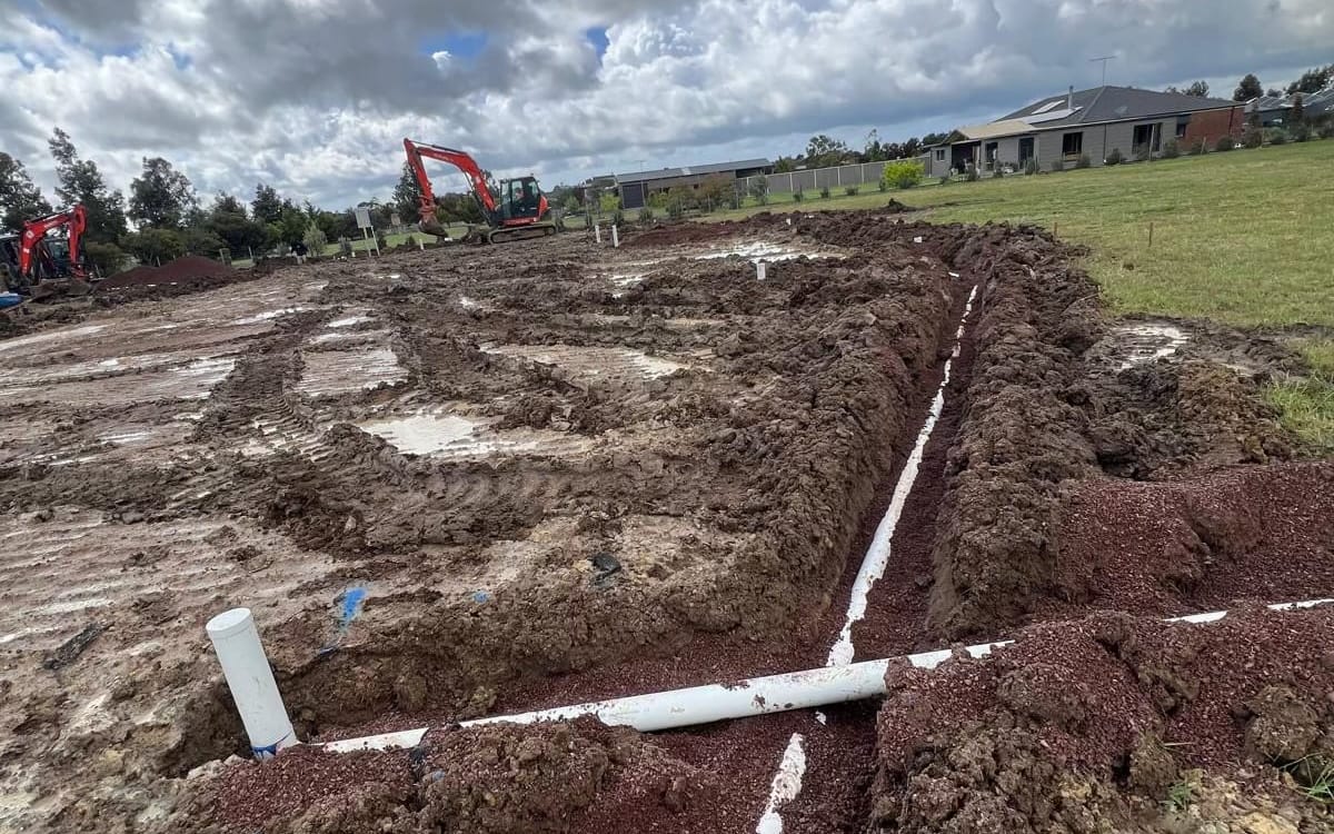 Drainage pipes roughed in on a new home site