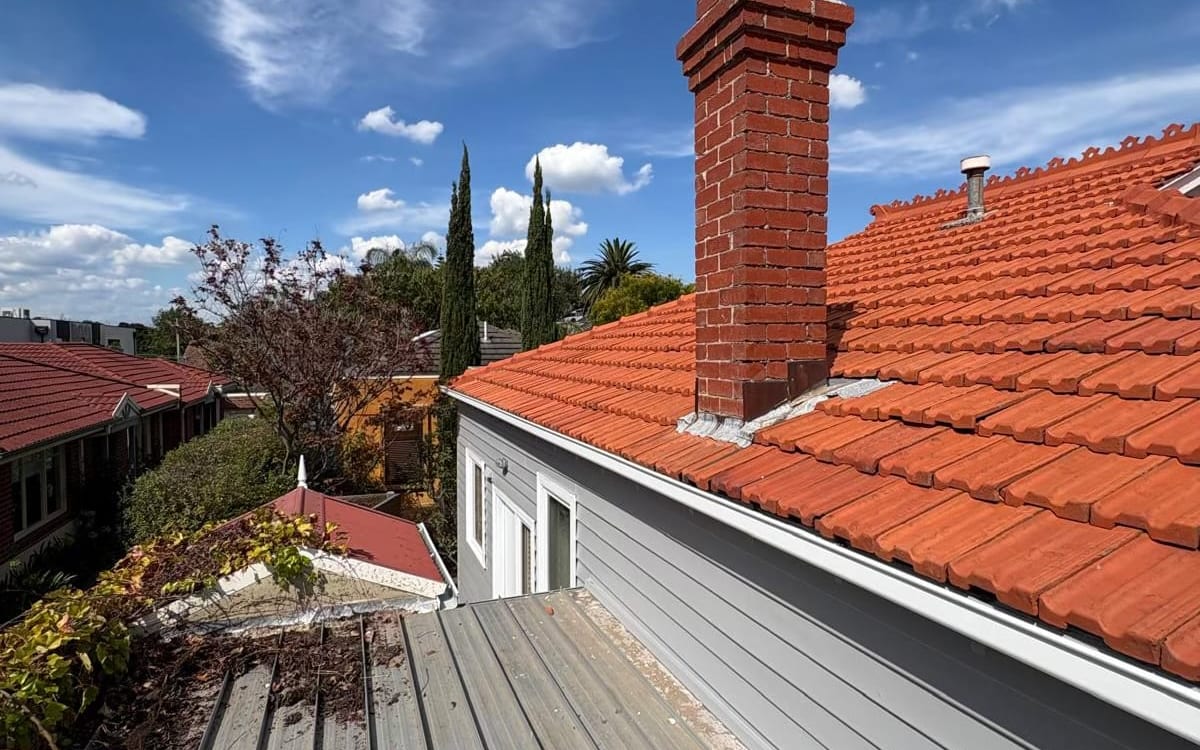 Terracotta tile roof and brick chimney