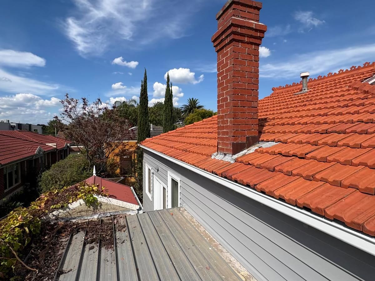 Roof plumbing and gutter work on a terracotta tile roof in Geelong by GSA Plumbing Services